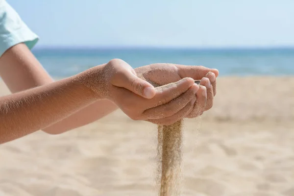Child Pouring Sand Hands Beach Sea Closeup Fleeting Time Concept — Fotografia de Stock