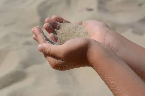 Child Pouring Sand Hands Outdoors Closeup Fleeting Time Concept — Fotografia de Stock