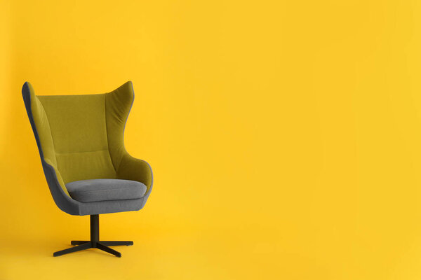 Modern office chair on yellow background. Space for text