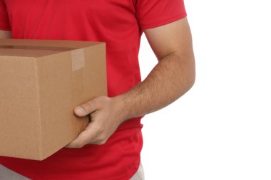 Courier holding cardboard box on white background, closeup