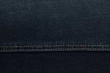 Arka plan olarak koyu mavi kotun dokusu, yakın plan