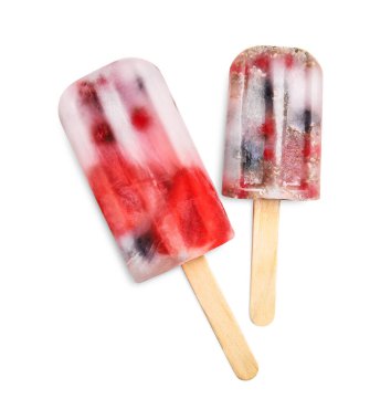 Tasty berry popsicles on white background, top view