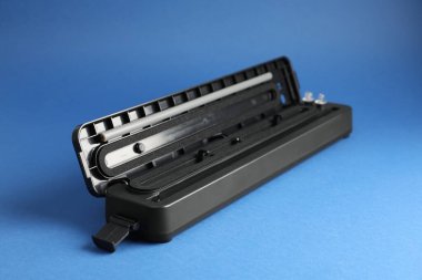 Sealer for vacuum packing on blue background