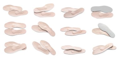 Set with orthopedic insoles on white background