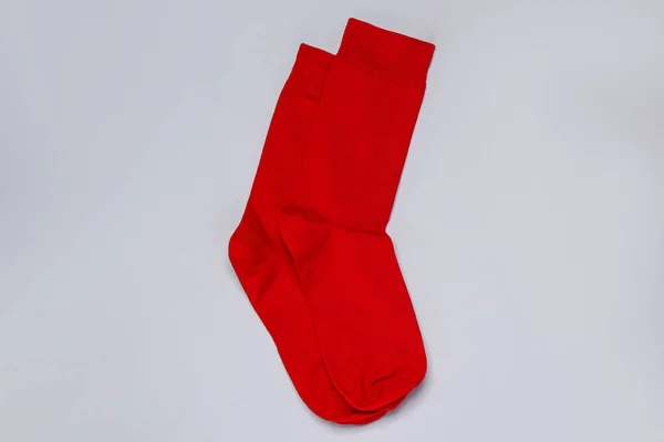 Pair Red Socks Light Grey Background Flat Lay — стоковое фото