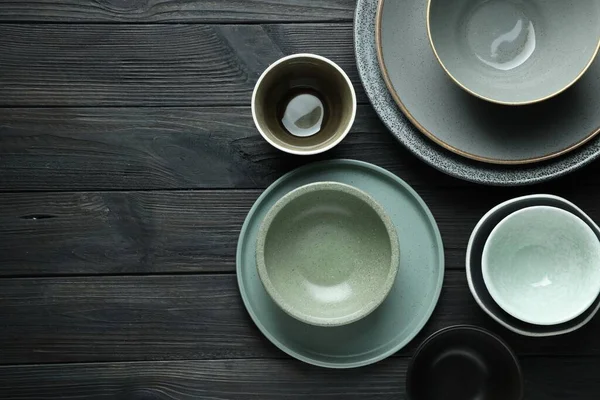 Stylish Empty Dishware Black Wooden Table Flat Lay Space Text — 图库照片