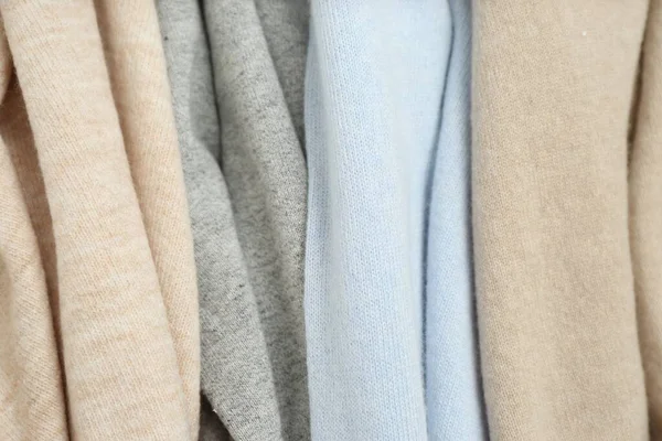 Different cashmere clothes as background, closeup view