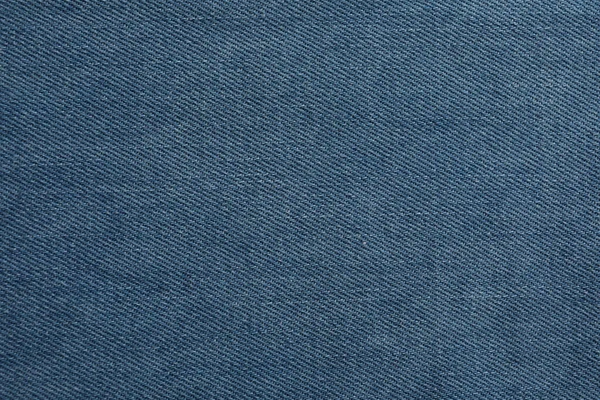 蓝色牛仔裤的面料为背景 — 图库照片