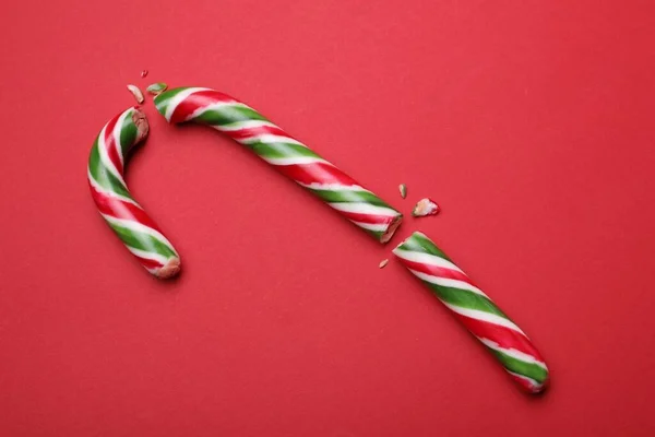Broken Sweet Christmas Candy Cane Red Background Top View — 스톡 사진