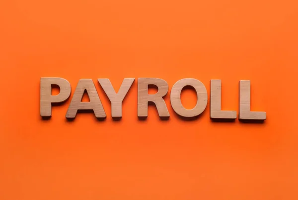 Word Payroll Made Wooden Letters Orange Background Top View — Photo