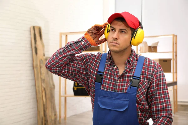 Worker Wearing Safety Headphones Indoors Hearing Protection Device — Stock Photo, Image
