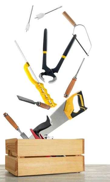 Different Carpenter Tools Falling Wooden Box White Background — Stock Fotó