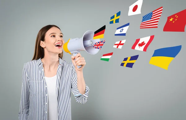 Portrait Interpreter Megaphone Flags Different Countries Grey Background — Stockfoto