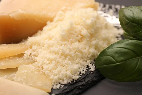 Delicious Grated Parmesan Cheese Black Slate Board Closeup — Stockfoto
