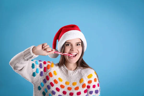 Pretty Woman Santa Hat Festive Sweater Eating Candy Cane Light — Photo