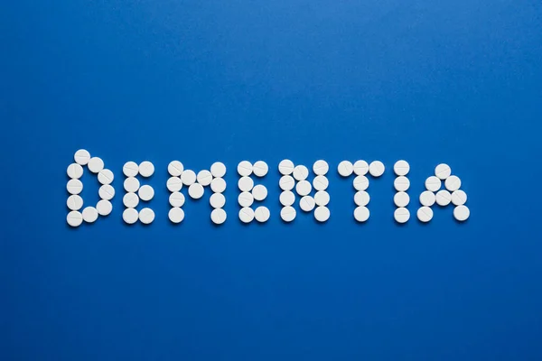 Word Dementia Made Pills Blue Background Flat Lay — Stockfoto