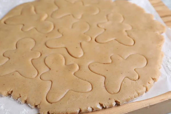 Making Homemade Christmas Cookies Dough Gingerbread Men Wooden Board Closeup — Stockfoto
