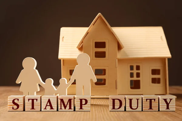 Stamp Duty Family House Wooden Figures Table — Photo
