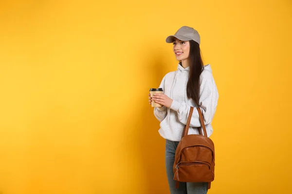 Beautiful Young Woman Stylish Leather Backpack Cup Coffee Yellow Background — Stock Photo, Image