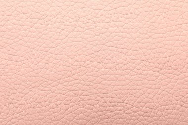 Arka plan olarak açık pembe deri dokusu, yakın plan