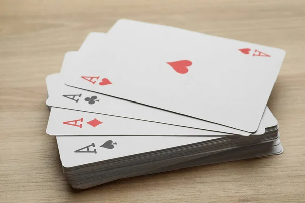 Four Aces Playing Cards Wooden Table Closeup — 图库照片