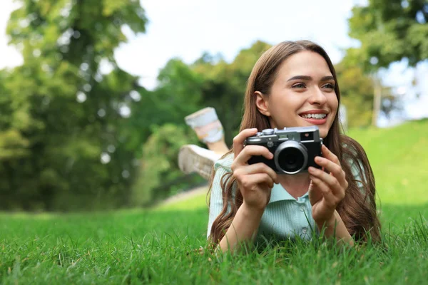 Young Woman Camera Green Grass Outdoors Space Text Interesting Hobby — Fotografia de Stock