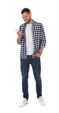 Smiling man with smartphone on white background