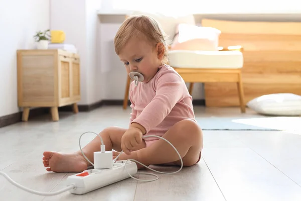 Cute Baby Playing Charger Floor Home Dangerous Situation — Stock Photo, Image