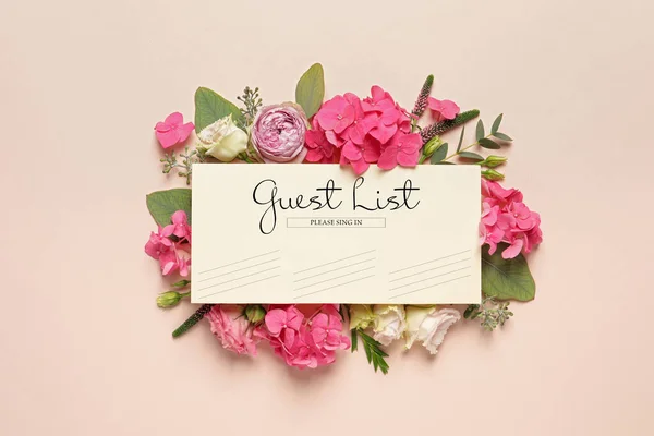 Beautiful flowers and guest list on beige background, flat lay