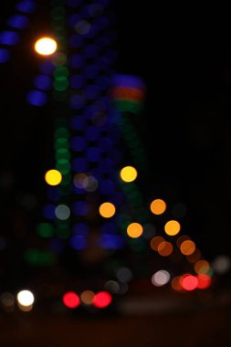 Blurred view of cityscape with bokeh effect. Night life
