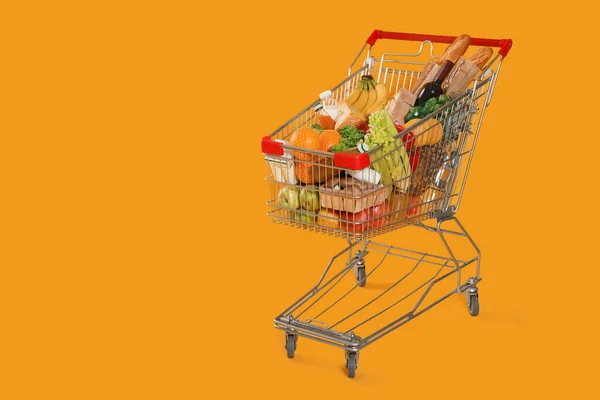 Einkaufswagen Voller Lebensmittel Auf Gelbem Hintergrund Raum Für Text — Stockfoto