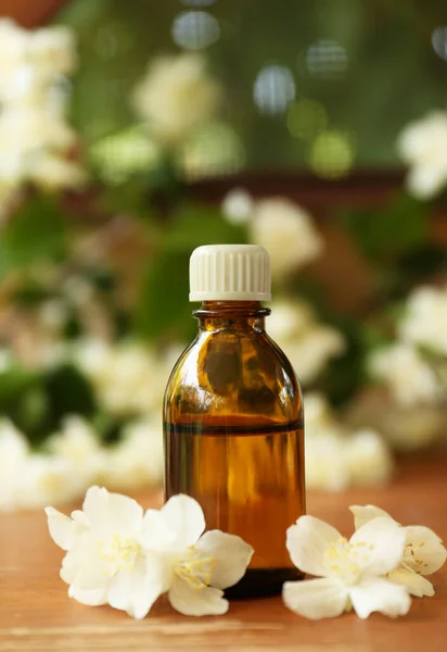 Bottle Jasmine Essential Oil Beautiful Flowers Wooden Table — Stockfoto