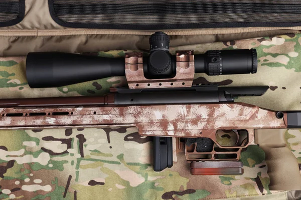 Modern Powerful Sniper Rifle Telescopic Sight Camouflage Fabric Top View — Stock Photo, Image