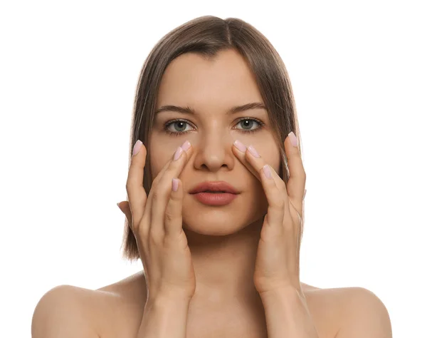 Young Woman Applying Cream Eyes White Background — Stok fotoğraf