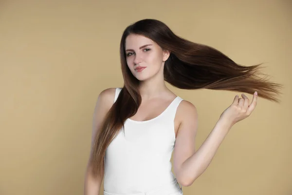Young Woman Strong Healthy Hair Beige Background — Stockfoto