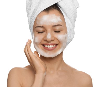 Young woman washing face with cleansing foam on white background. Skin care cosmetic