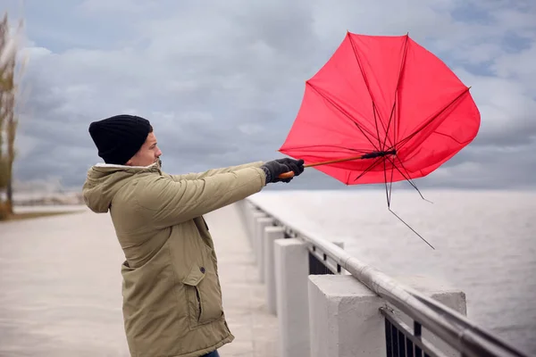 Man Red Umbrella Caught Gust Wind River — Stock Photo, Image