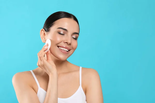 Young Woman Using Cotton Pad Micellar Water Light Blue Background — Foto Stock