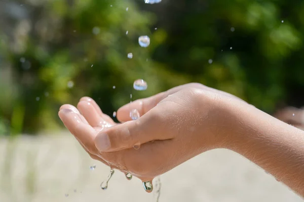 Pouring Water Kid Hand Outdoors Closeup — Fotografia de Stock