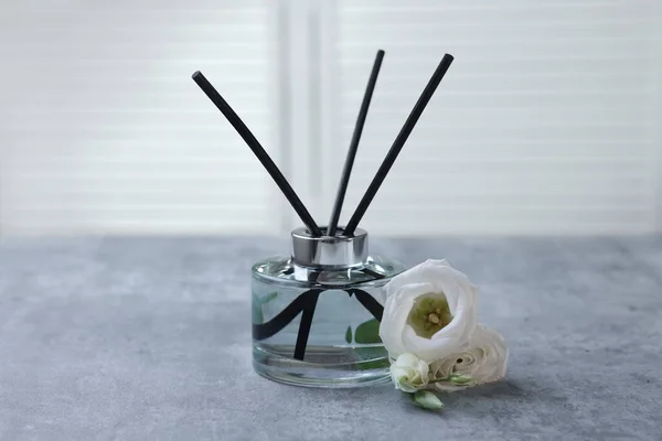Reed Diffuser Eustoma Flowers Gray Marble Table — Stok fotoğraf