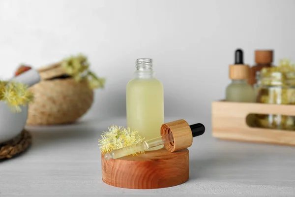 Bottle Essential Oil Linden Flowers White Wooden Table — Stock fotografie