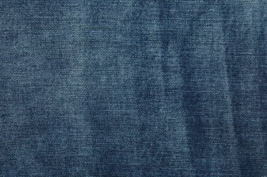 Arka plan olarak koyu mavi kotun dokusu, yakın plan
