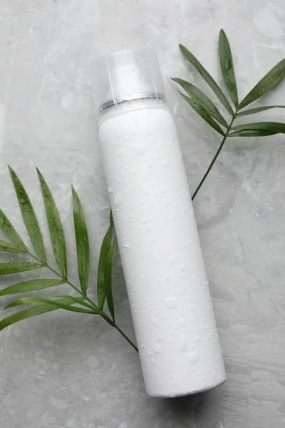 Dry Shampoo Spray Green Leaves Light Grey Table Flat Lay — Stock Photo, Image