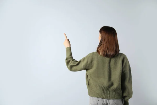 Young Girl Pointing White Background Back View Space Text —  Fotos de Stock