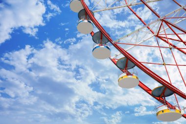 Beautiful large Ferris wheel against blue sky, low angle view