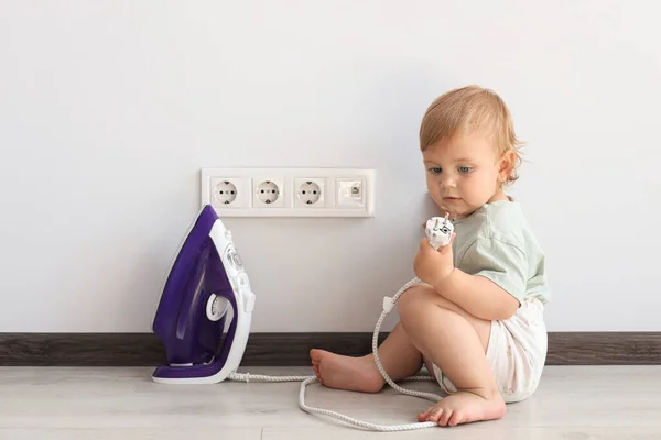 Cute Baby Playing Electrical Socket Iron Plug Home Dangerous Situation — 스톡 사진