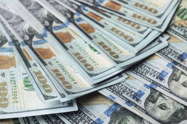 Dollar banknotes as background, closeup view. Money exchange
