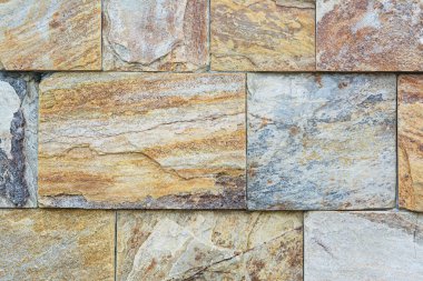 Arkaplan olarak mermer taş kiremitleri olan duvar, yakın plan