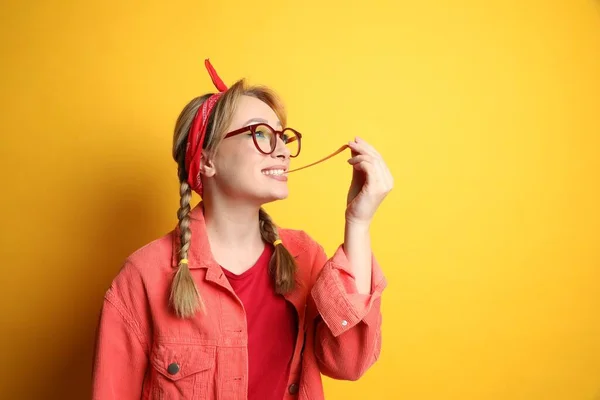 Fashionable Young Woman Braids Bright Makeup Chewing Bubblegum Yellow Background — Fotografia de Stock