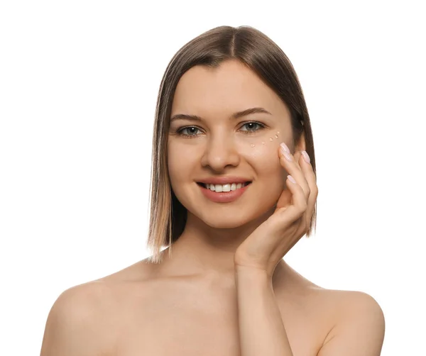 Young Woman Applying Cream Eyes White Background — Stockfoto